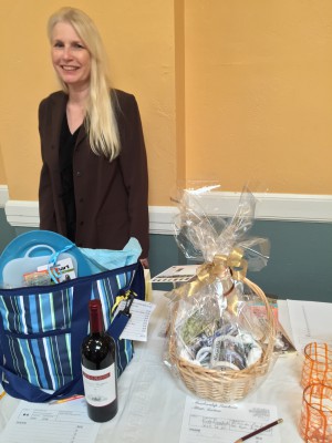 New Board Member and long-term Quarterly designer Valerie Turpen with some of the silent auction items up for bid.
